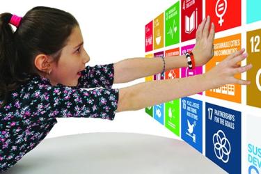 Child reaching for SDGs
